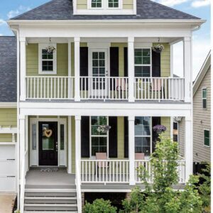 Cellular PVC trimboard installed on a house — corner boards, window casing, porch columns and railing