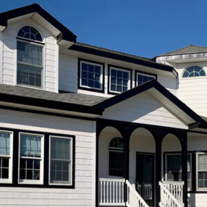 Black cellular PVC window trim on a white house