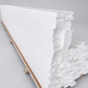 Bundle of white cellular PVC trim boards on bearers